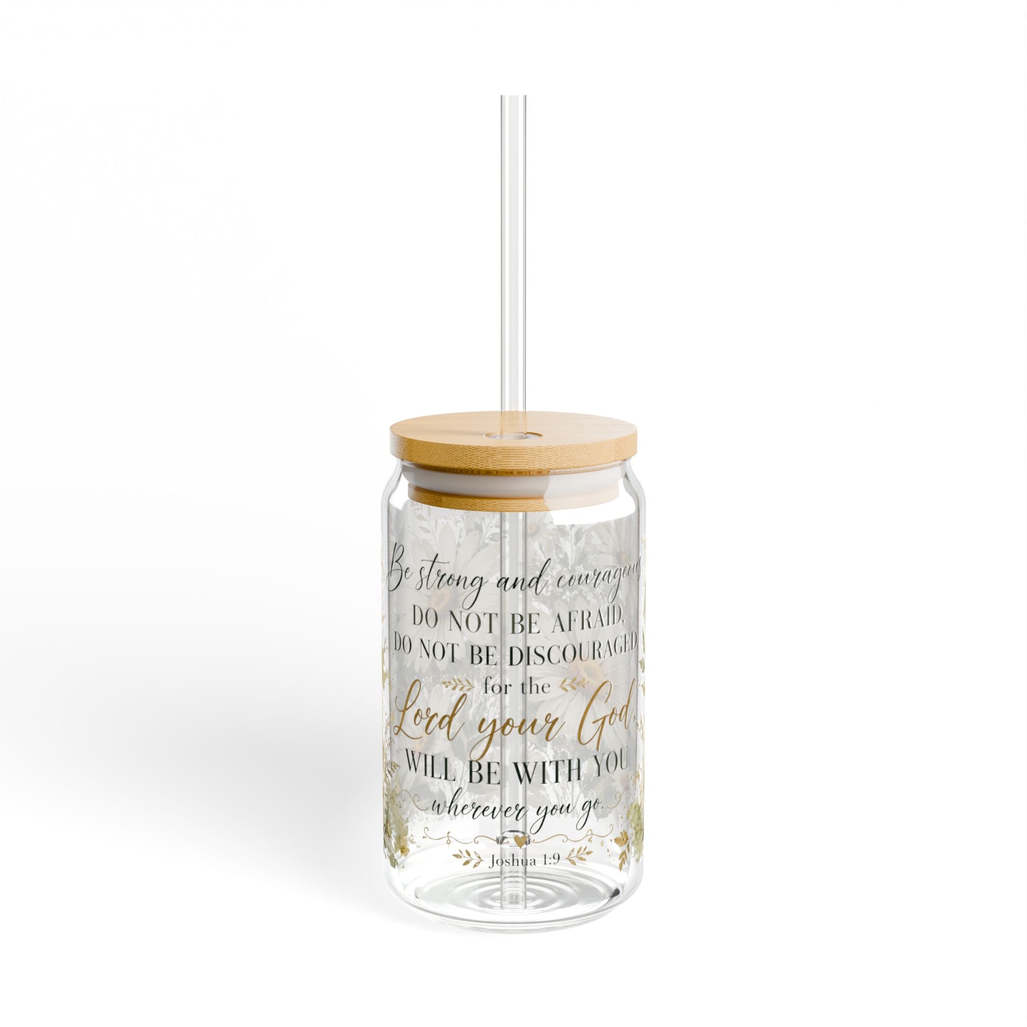 A clear glass tumbler with a bamboo lid and a clear straw, featuring a printed Bible verse in black and gold lettering on a white background.