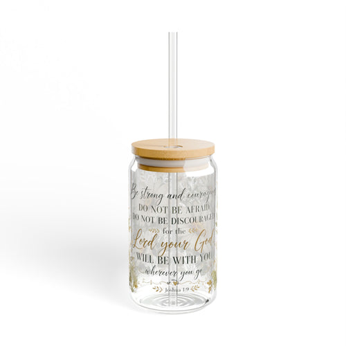 A clear glass tumbler with a bamboo lid and a clear straw, featuring a printed Bible verse in black and gold lettering on a white background.