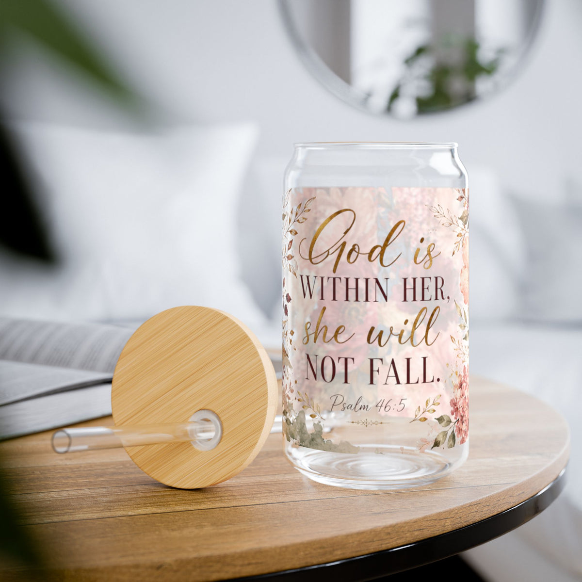 Glass tumbler with motivational text on a wooden table