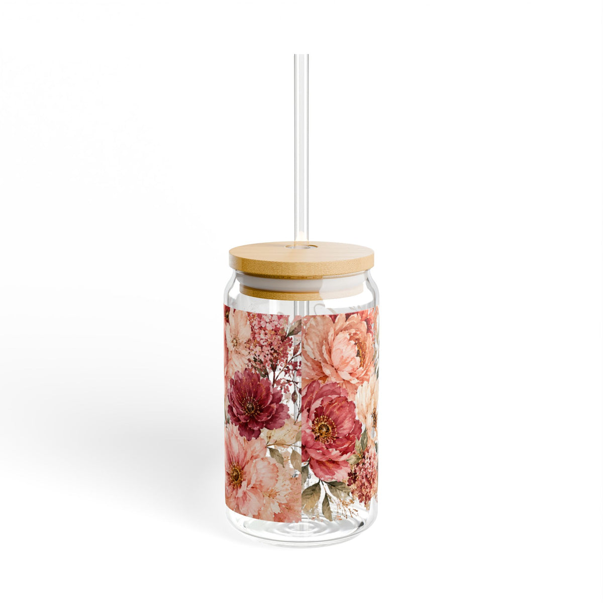A clear glass tumbler with a bamboo lid and a clear straw, decorated with a watercolor-style floral pattern in shades of pink, red, and peach, set against a plain white background.
