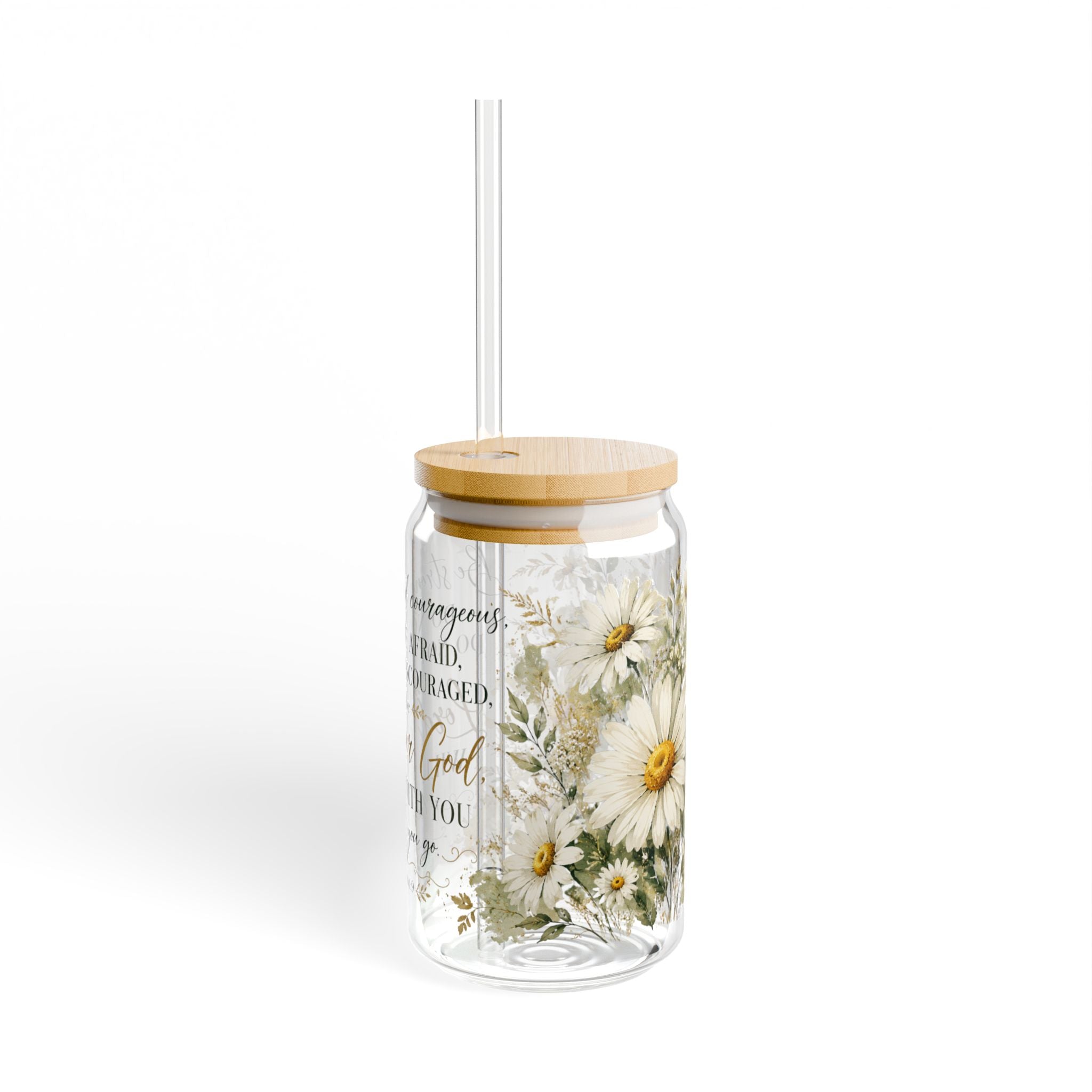A clear glass tumbler with a light wood lid and clear straw, decorated with white daisy flowers and gold script text, shown on a white background.