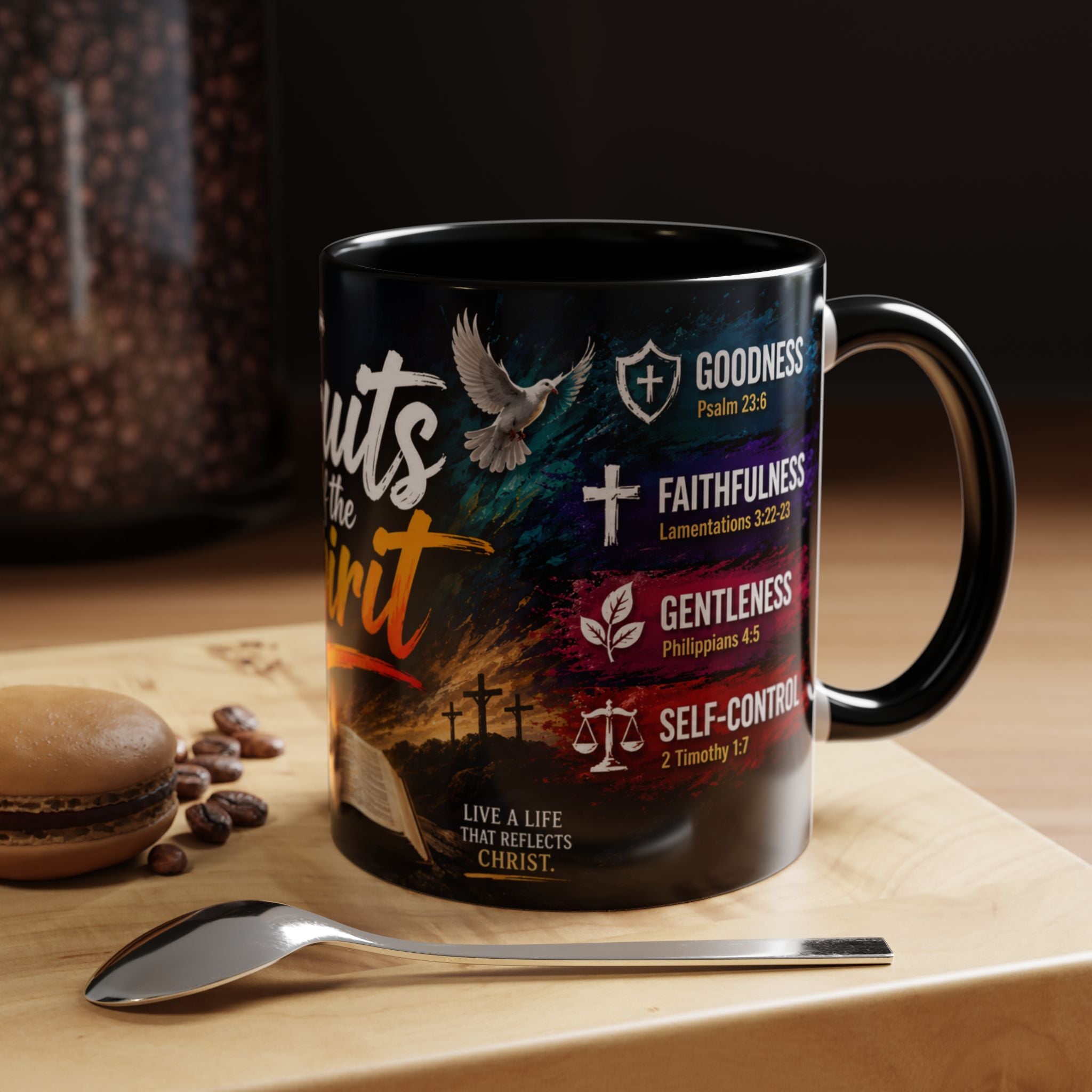 Black mug with motivational design on a wooden surface with coffee beans and a spoon.