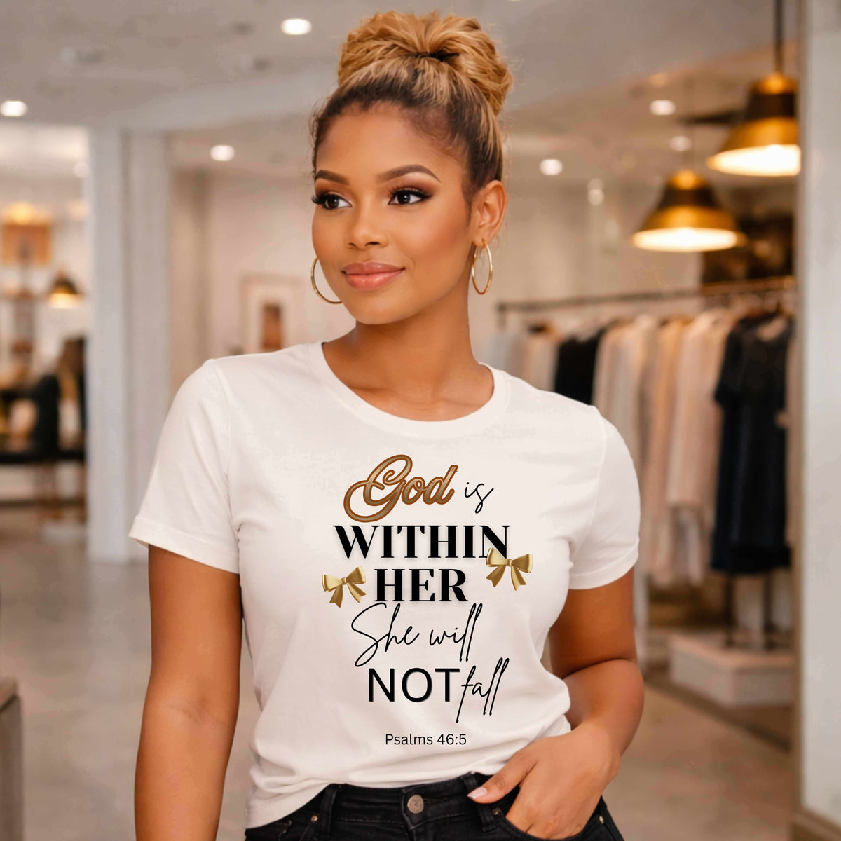 Woman wearing a white t-shirt with a quote God is within her she will not fall  in a clothing store.