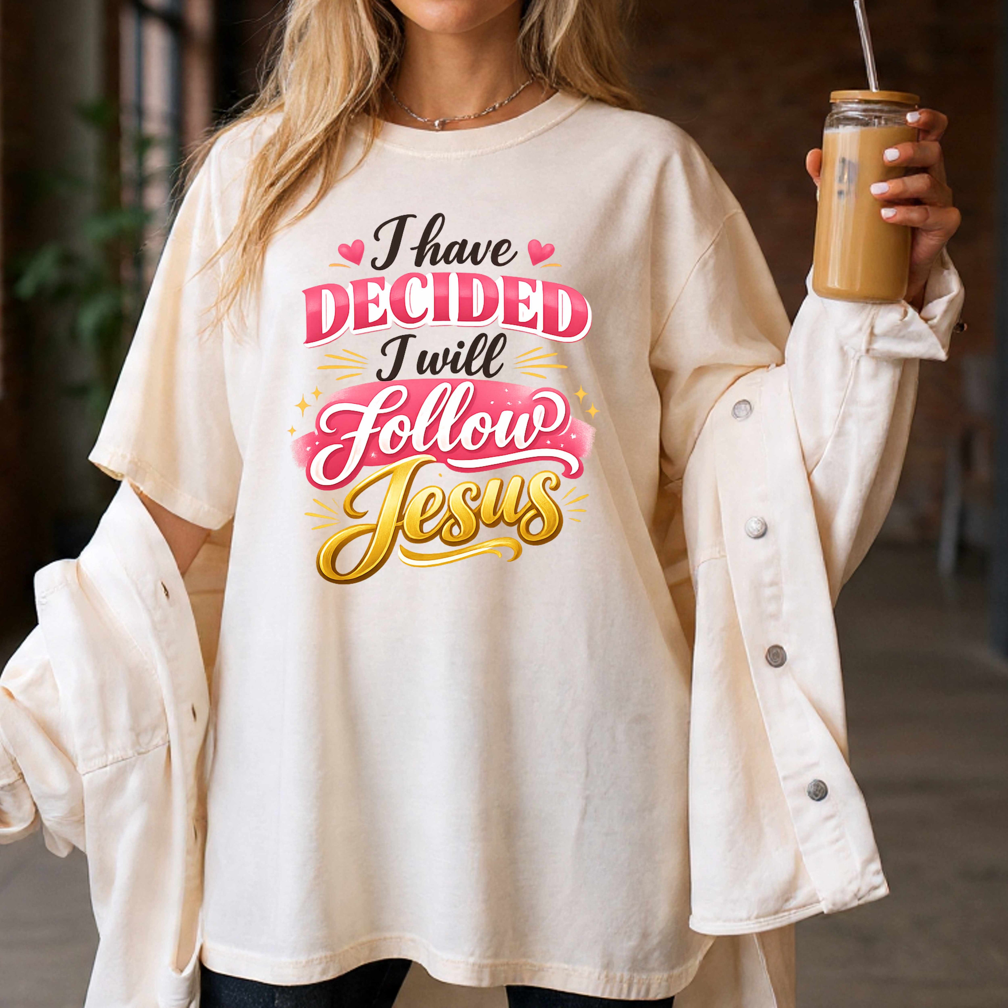 Person wearing a shirt with a religious message stating I have decided I will follow Jesus with holding a coffee cup.