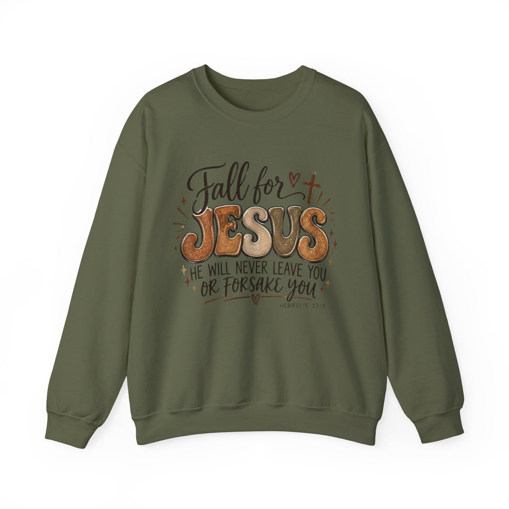 An olive green crewneck sweatshirt featuring a graphic print on the front with the text 'Fall for JESUS' and 'HE WILL NEVER LEAVE YOU OR FORSAKE YOU' in brown, orange, and black lettering.